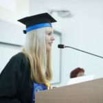 Female graduate delivering speech